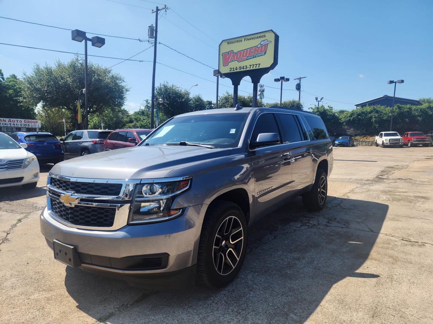 2019 Gray /Black Chevrolet Suburban (1GNSKHKC1KR) , located at 945 E. Jefferson Blvd, Dallas, TX, 75203, (214) 943-7777, 32.752514, -96.811630 - Photo#0